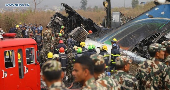 Rescuers work at the plane crash site in Kathmandu, Nepal, on March 12, 2018. At least 49 people were killed and 17 injured after a passenger plane of the US-Bangla Airlines crashed at Nepal's Tribhuvan International Airport (TIA) on Monday afternoon, authorities confirmed. (Xinhua/Sunil Sharma) Rescuers work at the plane crash site in Kathmandu, Nepal, on March 12, 2018. At least 49 people were killed and 17 injured after a passenger plane of the US-Bangla Airlines crashed at Nepal's Tribhuvan International Airport (TIA) on Monday afternoon, authorities confirmed. (Xinhua/Sunil Sharma)