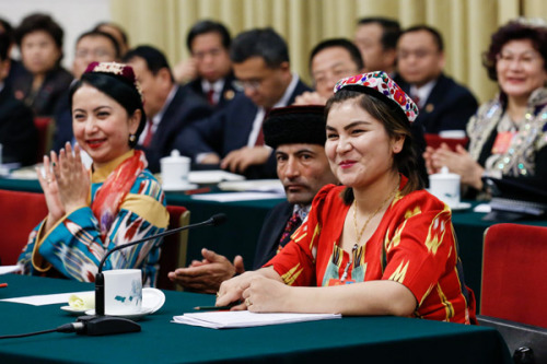 Ruqyam Masat, a deputy, addresses a plenary session of the Xinjiang delegation to the first session of the 13th National People's Congress in Beijing on Tuesday. (Photo by Kuang Linhua/China Daily)