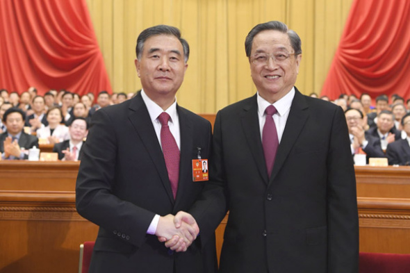 Wang Yang (left), elected chairman of the 13th National Committee of the Chinese People's Political Consultative Conference, shakes hands with Yu Zhengsheng, chairman of the 12th CPPCC National Committee, on Wednesday. (Photo/Xinhua) Wang Yang (left), elected chairman of the 13th National Committee of the Chinese People's Political Consultative Conference, shakes hands with Yu Zhengsheng, chairman of the 12th CPPCC National Committee, on Wednesday. (Photo/Xinhua)