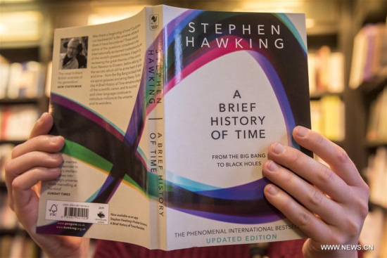A shop assistant poses with A Brief History of Time, the bestselling book of world renowned physicist Stephen Hawking, at a bookshop in London, Britain, on March 14, 2018. (Xinhua/Stephen Chung) A shop assistant poses with A Brief History of Time, the bestselling book of world renowned physicist Stephen Hawking, at a bookshop in London, Britain, on March 14, 2018. (Xinhua/Stephen Chung)
