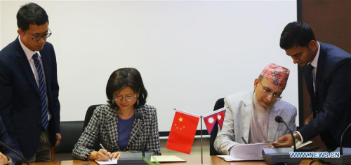 Chinese Ambassador to Nepal Yu Hong (2nd L) and Nepal's Secretary at Ministry of Finance Shankar Prasad Adhikari (2nd R) sign agreements on China-Aid projects in Kathmandu, Nepal, on March 15, 2018. (Xinhua/Sunil Sharma) Chinese Ambassador to Nepal Yu Hong (2nd L) and Nepal's Secretary at Ministry of Finance Shankar Prasad Adhikari (2nd R) sign agreements on China-Aid projects in Kathmandu, Nepal, on March 15, 2018. (Xinhua/Sunil Sharma)