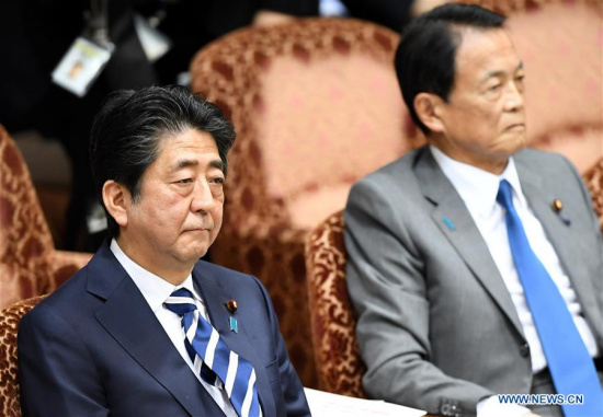 Japanese Prime Minister Shinzo Abe and Finance Minister Taro Aso attend an upper house Budget Committee session in Tokyo, Japan, March 19, 2018. (Xinhua/Ma Ping) Japanese Prime Minister Shinzo Abe and Finance Minister Taro Aso attend an upper house Budget Committee session in Tokyo, Japan, March 19, 2018. (Xinhua/Ma Ping)