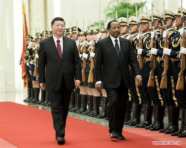 Chinese President Xi Jinping (L) holds a welcome ceremony for visiting Cameroonian President Paul Biya before their talks at the Great Hall of the People in Beijing, capital of China, March 22, 2018. (Xinhua/Li Tao) Chinese President Xi Jinping (L) holds a welcome ceremony for visiting Cameroonian President Paul Biya before their talks at the Great Hall of the People in Beijing, capital of China, March 22, 2018. (Xinhua/Li Tao)