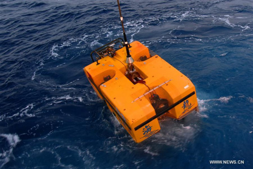Unmanned submersible Hailong III is put into the water for a deep sea testing from the Chinese research vessel Dayang Yihao (Ocean No. 1) on March 24, 2018. The submersible completed a 1690-meter-deep sea testing in west Pacific Ocean on Sunday. (Xinhua/Chen Hao)