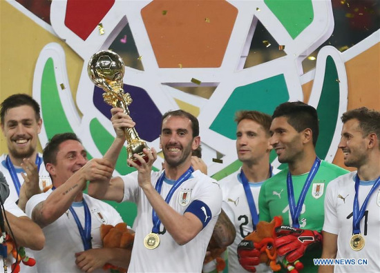 Players of Uruguay celebrate with their trophy during the awarding ceremony of the 2018 China Cup International Football Championship in Nanning, capital of south China's Guangxi Zhuang Autonomous Region, March 26, 2018. Uruguay won the final by 1-0 against Wales and claimed the title of the event. (Xinhua/Cao Can) Players of Uruguay celebrate with their trophy during the awarding ceremony of the 2018 China Cup International Football Championship in Nanning, capital of south China's Guangxi Zhuang Autonomous Region, March 26, 2018. Uruguay won the final by 1-0 against Wales and claimed the title of the event. (Xinhua/Cao Can)