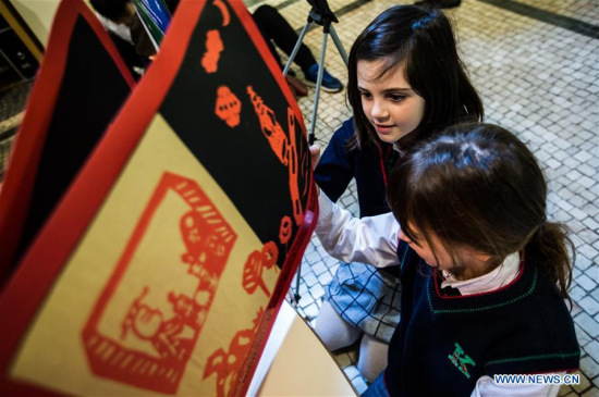 Students from Italian International School visit at an exhibition in Bologna, Italy, on March 28, 2018. An exhibition of picture books created by Chinese children kicked off on Wednesday, during the 55th Bologna Children's Book Fair. (Xinhua/Jin Yu) Students from Italian International School visit at an exhibition in Bologna, Italy, on March 28, 2018. An exhibition of picture books created by Chinese children kicked off on Wednesday, during the 55th Bologna Children's Book Fair. (Xinhua/Jin Yu)