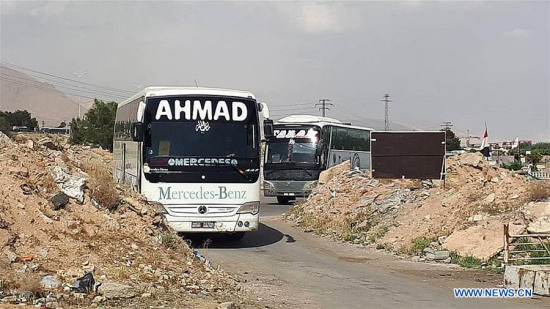 Buses to evacuate militants of the Islam Army as well as the kidnapped people enter the Wafideen area near Douma, northeast of Damascus, Syria, on April 8, 2018. (Xinhua/Ammar Safarjalani) Buses to evacuate militants of the Islam Army as well as the kidnapped people enter the Wafideen area near Douma, northeast of Damascus, Syria, on April 8, 2018. (Xinhua/Ammar Safarjalani)