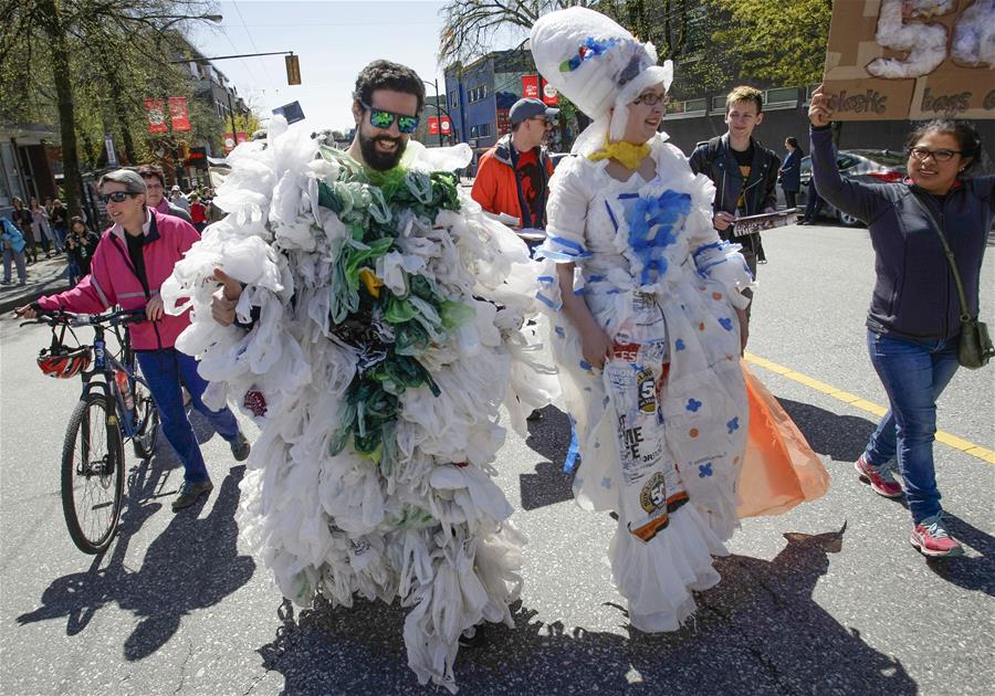 Participants dress with costumes that made with plastic bags during the Earth Day Parade in Vancouver, Canada, on April 21, 2018. Hundreds of people took part in the acitivity to show support for environmental protection. Participants dress with costumes that made with plastic bags during the Earth Day Parade in Vancouver, Canada, on April 21, 2018. Hundreds of people took part in the acitivity to show support for environmental protection.