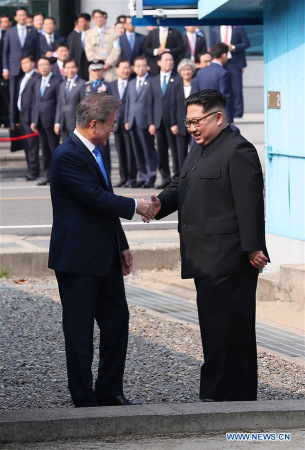 South Korean President Moon Jae-in (L) shakes hands with top leader of the Democratic People's Republic of Korea (DPRK) Kim Jong Un in the border village of Panmunjom on April 27, 2018. Moon Jae-in arrived Friday morning in the border village of Panmunjom for his first summit with Kim Jong Un. (Xinhua/Inter-Korean Summit Press Corps) South Korean President Moon Jae-in (L) shakes hands with top leader of the Democratic People's Republic of Korea (DPRK) Kim Jong Un in the border village of Panmunjom on April 27, 2018. Moon Jae-in arrived Friday morning in the border village of Panmunjom for his first summit with Kim Jong Un. (Xinhua/Inter-Korean Summit Press Corps)