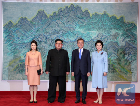 South Korean President Moon Jae-in (2nd R) and his wife Kim Jung-sook (1st R) pose for photos with Kim Jong Un (2nd L), top leader of the Democratic People's Republic of Korea (DPRK) and his wife Ri Sol Ju at Peace House on the South Korean side of Panmunjom, on April 27, 2018. (Photo/Xinhua) South Korean President Moon Jae-in (2nd R) and his wife Kim Jung-sook (1st R) pose for photos with Kim Jong Un (2nd L), top leader of the Democratic People's Republic of Korea (DPRK) and his wife Ri Sol Ju at Peace House on the South Korean side of Panmunjom, on April 27, 2018. (Photo/Xinhua)