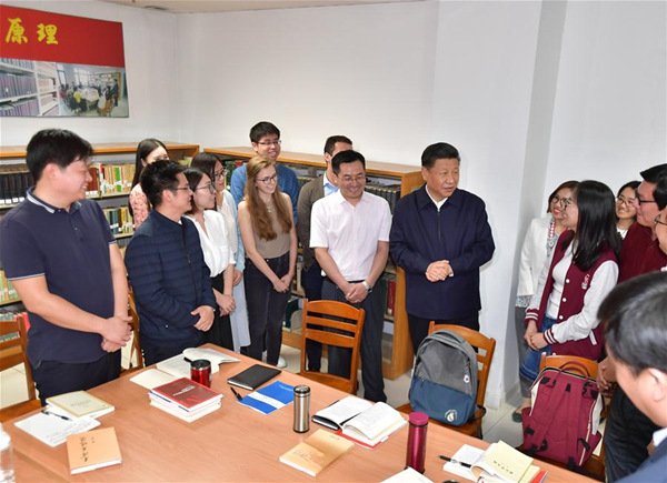 Chinese President Xi Jinping, also general secretary of the Communist Party of China Central Committee and chairman of the Central Military Commission, joins a group of Chinese and foreign students who are discussing topics related to interpreting the new era at the School of Marxism of Peking University (PKU) in Beijing, capital of China, May 2, 2018. Xi made an inspection tour of PKU on Wednesday. (Xinhua/Li Tao) Chinese President Xi Jinping, also general secretary of the Communist Party of China Central Committee and chairman of the Central Military Commission, joins a group of Chinese and foreign students who are discussing topics related to interpreting the new era at the School of Marxism of Peking University (PKU) in Beijing, capital of China, May 2, 2018. Xi made an inspection tour of PKU on Wednesday. (Xinhua/Li Tao)