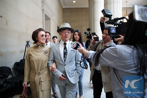 Chinese comedian Zhou libo and his wife Hu Jie are on their way to the courtroom in Nassau County, New York, the United States, May 9, 2018. Zhou's case on weapon and drug charges will resume court on May 24. (Photo/Xinhua) Chinese comedian Zhou libo and his wife Hu Jie are on their way to the courtroom in Nassau County, New York, the United States, May 9, 2018. Zhou's case on weapon and drug charges will resume court on May 24. (Photo/Xinhua)