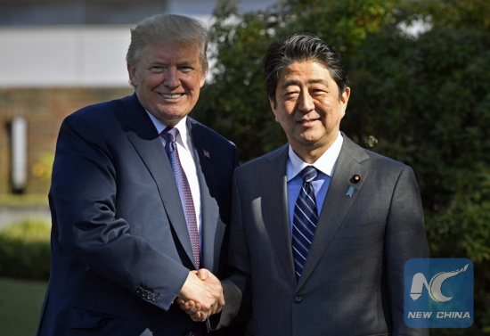 File Photo: U.S. President Donald Trump (L) shakes hands with Japanese Prime Minister Shinzo Abe upon his arrival at the Kasumigaseki Country Club in Kawagoe, near Tokyo, Japan, Nov. 5, 2017. (Xinhua) File Photo: U.S. President Donald Trump (L) shakes hands with Japanese Prime Minister Shinzo Abe upon his arrival at the Kasumigaseki Country Club in Kawagoe, near Tokyo, Japan, Nov. 5, 2017. (Xinhua)