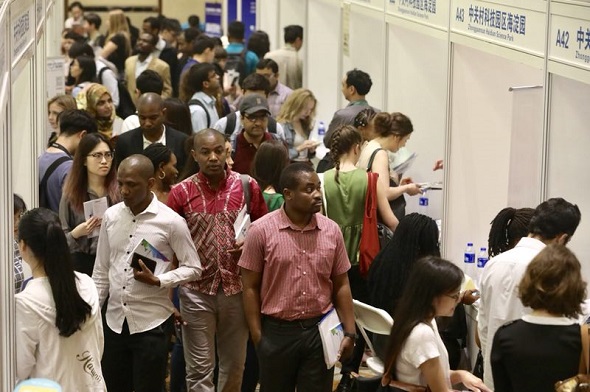 International students search for jobs at the Fifth Career Fair for International Students in China at Peking University, Beijing, on May 12, 2018. (Photo by Zhu Xingxin/China Daily) International students search for jobs at the Fifth Career Fair for International Students in China at Peking University, Beijing, on May 12, 2018. (Photo by Zhu Xingxin/China Daily)