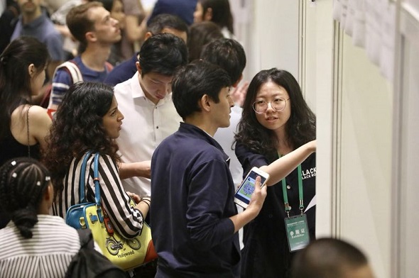 International students search for jobs at the Fifth Career Fair for International Students in China at Peking University, Beijing, on May 12, 2018. (Photo by Zhu Xingxin/China Daily) International students search for jobs at the Fifth Career Fair for International Students in China at Peking University, Beijing, on May 12, 2018. (Photo by Zhu Xingxin/China Daily)