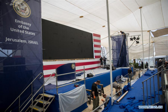 Workers prepare the stage for the opening ceremony of the new U.S. embassy in Jerusalem on May 13, 2018. Israel prepares on Sunday for the opening ceremony of the new U.S. embassy in Jerusalem on Monday, a move that has sparked Palestinian protests. (Xinhua/JINI) Workers prepare the stage for the opening ceremony of the new U.S. embassy in Jerusalem on May 13, 2018. Israel prepares on Sunday for the opening ceremony of the new U.S. embassy in Jerusalem on Monday, a move that has sparked Palestinian protests. (Xinhua/JINI)