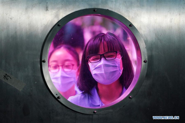 Volunteers prepare to leave the Yuegong-1, or Lunar Palace 1, at Beihang University in Beijing, capital of China, May 15, 2018. Chinese volunteers have completed a one-year test living in a simulated space lab in Beijing, setting a new record for the longest stay in a self-contained cabin. (Xinhua/Ju Huanzong) Volunteers prepare to leave the Yuegong-1, or Lunar Palace 1, at Beihang University in Beijing, capital of China, May 15, 2018. Chinese volunteers have completed a one-year test living in a simulated space lab in Beijing, setting a new record for the longest stay in a self-contained cabin. (Xinhua/Ju Huanzong)
