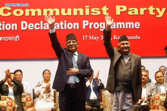 Chairman of Communist Party of Nepal (United Marxist Leninist) (CPN-UML) KP Sharma Oli (right) and Chairman of Communist Party of Nepal (Maoist Centre) Pushpa Kamal Dahal wave after announcing the unification of the two parties in Kathmandu, Nepal, on May 17, 2018. (Photo/Xinhua) Chairman of Communist Party of Nepal (United Marxist Leninist) (CPN-UML) KP Sharma Oli (right) and Chairman of Communist Party of Nepal (Maoist Centre) Pushpa Kamal Dahal wave after announcing the unification of the two parties in Kathmandu, Nepal, on May 17, 2018. (Photo/Xinhua)