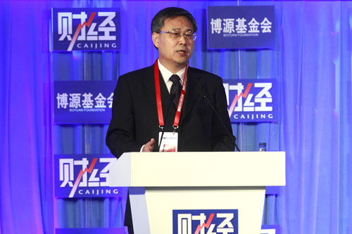 Guo Shuqing, chairman of China's Securities Regulatory Commission, at the Caijing Annual Conference 2012 in Beijing in December. He said on Thursday that he plans to allow small and medium-sized enterprises to issue high-yield bonds. [Photo/China Daily]