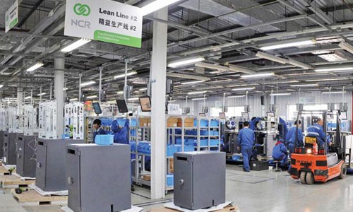 ATM's production line at NCR's Beijing manufacturing plant - NCR (Beijing) Financial Equipment Co. The company is a major ATM supplier for Chinese commercial banks. [Photo/China Daily]