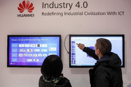 Two staff members work at Huawei's stand of the 2015 CeBIT Technology Trade fair in Hanover, Germany, on March 14, 2015. (Photo: Xinhua/Zhang Fan) Two staff members work at Huawei's stand of the 2015 CeBIT Technology Trade fair in Hanover, Germany, on March 14, 2015. (Photo: Xinhua/Zhang Fan)
