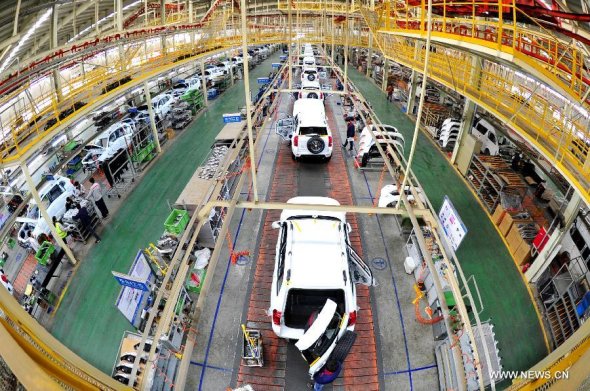 People work at a factory of China's Beijing Automotive Industry Corp (BAIC) in Huanghua, north China's Hebei Province, March 19, 2015. China's GDP expanded 7 percent year-on-year in the first quarter, the National Bureau of Statistics(NBS) data showed on April 15, 2015. (Xinhua/Mou Yu) People work at a factory of China's Beijing Automotive Industry Corp (BAIC) in Huanghua, north China's Hebei Province, March 19, 2015. China's GDP expanded 7 percent year-on-year in the first quarter, the National Bureau of Statistics(NBS) data showed on April 15, 2015. (Xinhua/Mou Yu)