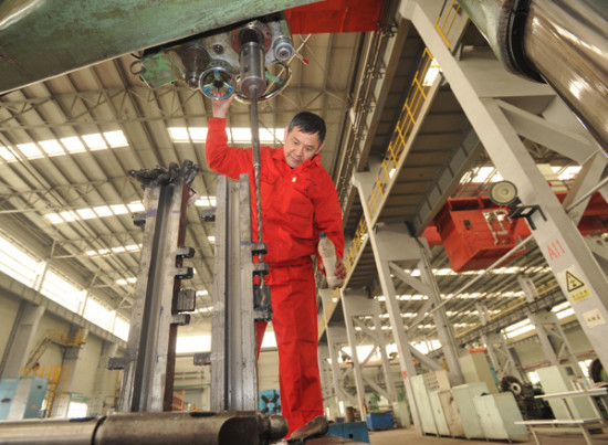 A worker processes products at a company under the Dalian-based Northeast Special Steel Group. (Photo/China Daily) A worker processes products at a company under the Dalian-based Northeast Special Steel Group. (Photo/China Daily)