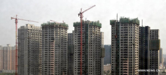 Photo taken on May 16, 2015 shows commercial residential buildings under construction in the Jinshui District of Zhengzhou, capital of central China's Henan Province. China's real estate market remained anemic with new home prices in April registering month-on-month declines in 48 of the 70 surveyed cities. (Xinhua/Li Bo) Photo taken on May 16, 2015 shows commercial residential buildings under construction in the Jinshui District of Zhengzhou, capital of central China's Henan Province. China's real estate market remained anemic with new home prices in April registering month-on-month declines in 48 of the 70 surveyed cities. (Xinhua/Li Bo)