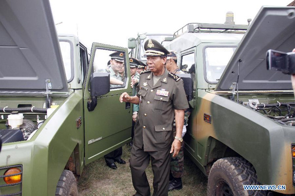 Cambodian Deputy Prime Minister and Defense Minister Tea Banh (front) inspects vehicles provided by China at the Infantry Institute in Kampong Speu Province, Cambodia, May 23, 2015. China delivered army vehicles and spare parts to Cambodia on Saturday for a training program in auto-repair class at the Infantry Institute, officials said. (Photo: Xinhua/Sovannara) Cambodian Deputy Prime Minister and Defense Minister Tea Banh (front) inspects vehicles provided by China at the Infantry Institute in Kampong Speu Province, Cambodia, May 23, 2015. China delivered army vehicles and spare parts to Cambodia on Saturday for a training program in auto-repair class at the Infantry Institute, officials said. (Photo: Xinhua/Sovannara)