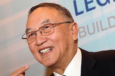 Liu Chuanzhi, chairman of Legend Holdings Corp, speaks at a news conference on the company's IPO in Hong Kong on Monday.(Photo/China Daily)