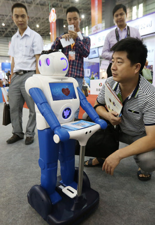 A robot on display at the China Processing Trade Products Fair, which opened in Dongguan, Guangdong province, on Wednesday. The robot can talk in simple words with its owner and do some simple domestic chores such as turning on and off TV sets. (Photo/China Daily) A robot on display at the China Processing Trade Products Fair, which opened in Dongguan, Guangdong province, on Wednesday. The robot can talk in simple words with its owner and do some simple domestic chores such as turning on and off TV sets. (Photo/China Daily)