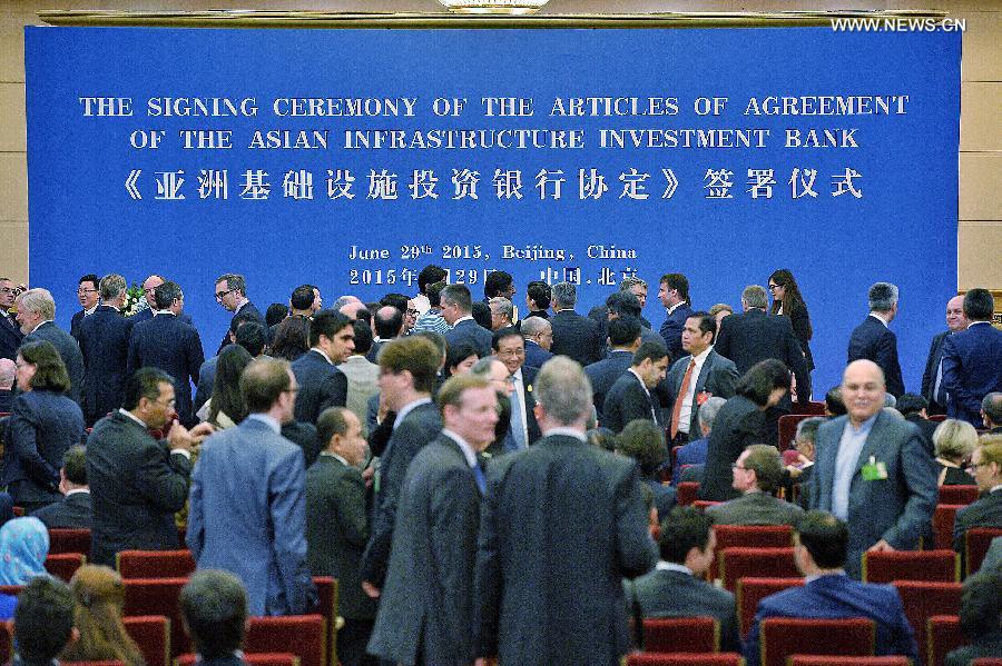 Representatives of prospective founders of the Asian Infrastructure Investment Bank (AIIB) prepare to attend the signing ceremony of the articles of agreement of AIIB in Beijing, capital of China, June 29, 2015. (Photo: Xinhua/Li Xin) Representatives of prospective founders of the Asian Infrastructure Investment Bank (AIIB) prepare to attend the signing ceremony of the articles of agreement of AIIB in Beijing, capital of China, June 29, 2015. (Photo: Xinhua/Li Xin)