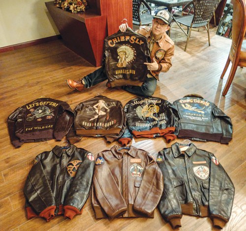 Yu Qian shows off his collection of flying jackets. The most expensive one costs almost 50,000 yuan. (Photo provided to China Daily) Yu Qian shows off his collection of flying jackets. The most expensive one costs almost 50,000 yuan. (Photo provided to China Daily)