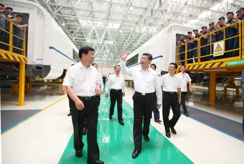 Chinese President Xi Jinping (center) talks with workers during his visit to Changchun Railway Vehicles Co. Ltd. in Changchun, capital of northeast China's Jilin Province, on July 17 (XINHUA) Chinese President Xi Jinping (center) talks with workers during his visit to Changchun Railway Vehicles Co. Ltd. in Changchun, capital of northeast China's Jilin Province, on July 17 (XINHUA)