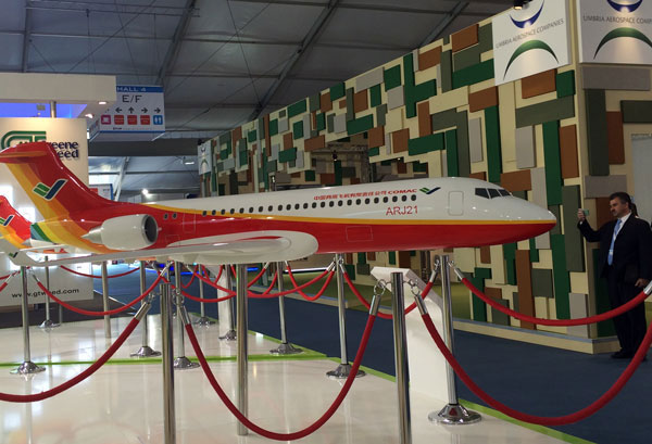 A model of ARJ21700, China's homegrown regional jetliner, on display at the 2014 Farnborough International Airshow. (Photo/China Daily) A model of ARJ21700, China's homegrown regional jetliner, on display at the 2014 Farnborough International Airshow. (Photo/China Daily)