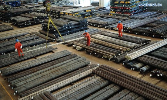Workers are busy at a manufacture base of Dongbei Special Steel Group Co., Ltd. in Dalian, northeast China's Liaoning Province, Oct. 13, 2015.  (PhotoXinhua/Liu Debin)