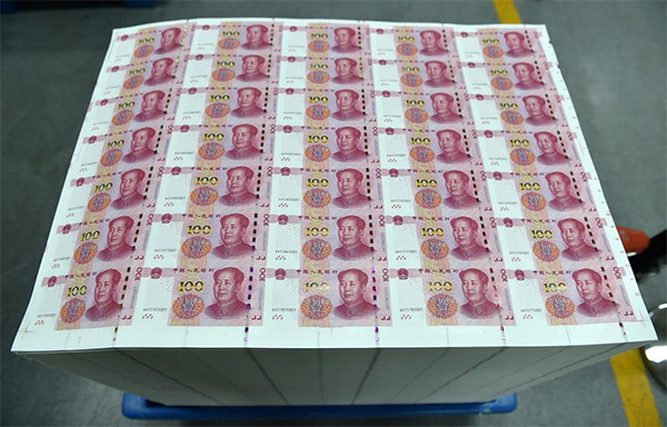 New 100-yuan notes wheeled out in the factory of China Banknote Printing and Minting Corporation, Oct 29. (Photo/Xinhua) New 100-yuan notes wheeled out in the factory of China Banknote Printing and Minting Corporation, Oct 29. (Photo/Xinhua)