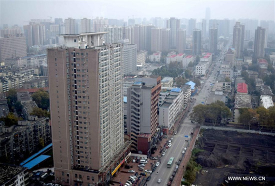 Photo taken on Nov. 18, 2015 shows residential buildings in Zhengshou, capital of central China's Henan Province. (Xinhua/Li An) Photo taken on Nov. 18, 2015 shows residential buildings in Zhengshou, capital of central China's Henan Province. (Xinhua/Li An)
