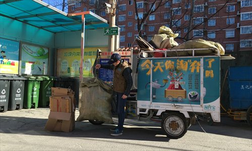 A Taoqbao employee collects recyclables in Beijing's Haidian district on Sunday. (Photo: Zhang Ye/GT) A Taoqbao employee collects recyclables in Beijing's Haidian district on Sunday. (Photo: Zhang Ye/GT)