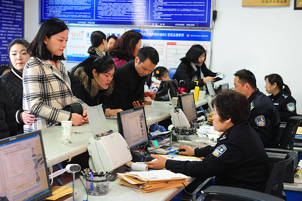 Police in charge of exit and entry management receive passport applications in Fuyang, Anhui province, in February. Applicants are looking for work overseas. (Wang Biao / for China Daily) Police in charge of exit and entry management receive passport applications in Fuyang, Anhui province, in February. Applicants are looking for work overseas. (Wang Biao / for China Daily)