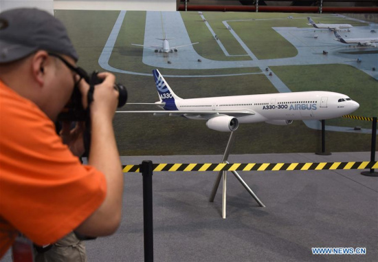 A man takes pictures of an A330 aircraft model at the ground breaking ceremony for Airbus Tianjin A330 completion and delivery center in the Tianjin Airport Economic Area of north China's Tianjin Municipality, March 2, 2016. (photo/Xinhua) A man takes pictures of an A330 aircraft model at the ground breaking ceremony for Airbus Tianjin A330 completion and delivery center in the Tianjin Airport Economic Area of north China's Tianjin Municipality, March 2, 2016. (photo/Xinhua)