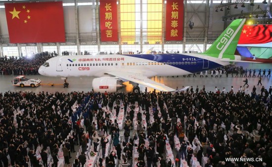 Photo taken on Nov. 2, 2015 shows the C919, China's first homemade large passenger aircraft, at a plant of Commercial Aircraft Corporation of China, Ltd. (COMAC), in Shanghai, east China. China's economy grew by 6.9 percent in 2015. (Xinhua file photo/Pei Xin) Photo taken on Nov. 2, 2015 shows the C919, China's first homemade large passenger aircraft, at a plant of Commercial Aircraft Corporation of China, Ltd. (COMAC), in Shanghai, east China. China's economy grew by 6.9 percent in 2015. (Xinhua file photo/Pei Xin)
