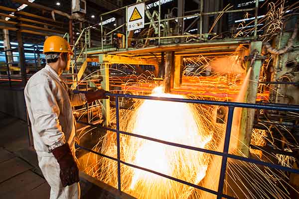 A worker at a steel company in Lianyungang, Jiangsu province, in January 2015. The steel sector will reduce capacity by 100 to 150 million metric tons in five years, according to China's top economic planner.(Photo by Si Wei/China Daily) A worker at a steel company in Lianyungang, Jiangsu province, in January 2015. The steel sector will reduce capacity by 100 to 150 million metric tons in five years, according to China's top economic planner.(Photo by Si Wei/China Daily)