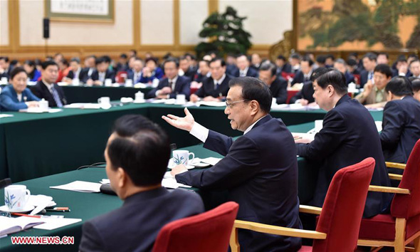 Chinese Premier Li Keqiang joins a group deliberation of deputies from Shandong Province to the annual session of the National People's Congress in Beijing, capital of China, March 6, 2016. (Photo: Xinhua/Gao Jie) Chinese Premier Li Keqiang joins a group deliberation of deputies from Shandong Province to the annual session of the National People's Congress in Beijing, capital of China, March 6, 2016. (Photo: Xinhua/Gao Jie)