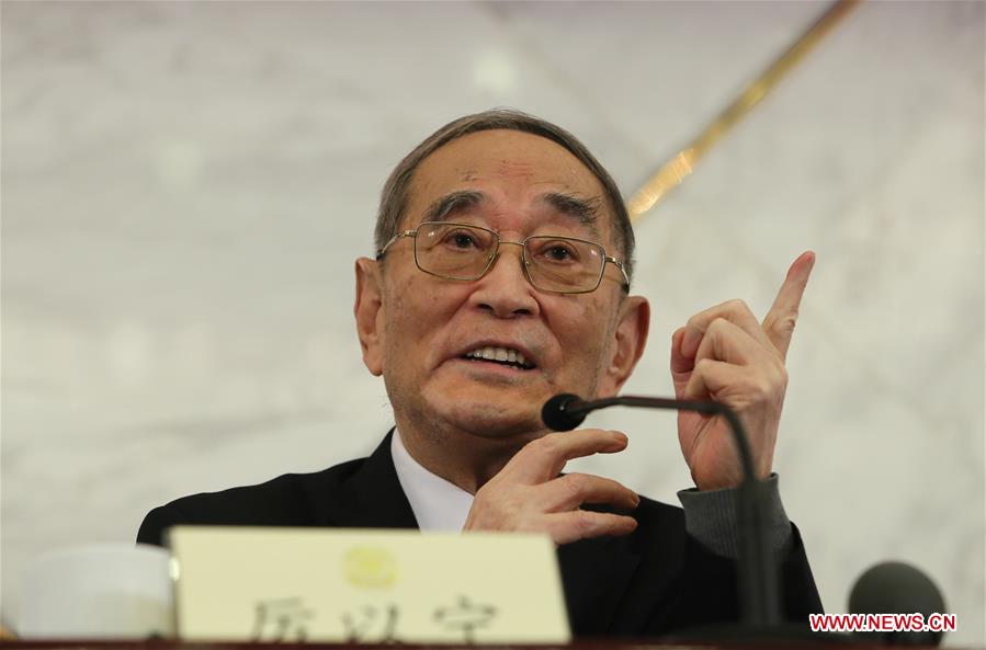 Li Yining answers question at the press conference on the supply-side structural reform at the Great Hall of the People in Beijing on March 6, 2016. (Photo/Xinhua) Li Yining answers question at the press conference on the supply-side structural reform at the Great Hall of the People in Beijing on March 6, 2016. (Photo/Xinhua)