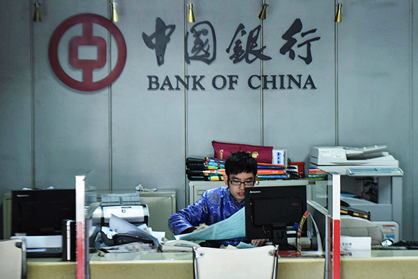 A worker at a Bank of China branch in Hangzhou, Zhejiang province. Chinese banks have the ability to withstand risks with a provision coverage ratio of 180 percent. (Photo/China Daily) A worker at a Bank of China branch in Hangzhou, Zhejiang province. Chinese banks have the ability to withstand risks with a provision coverage ratio of 180 percent. (Photo/China Daily)