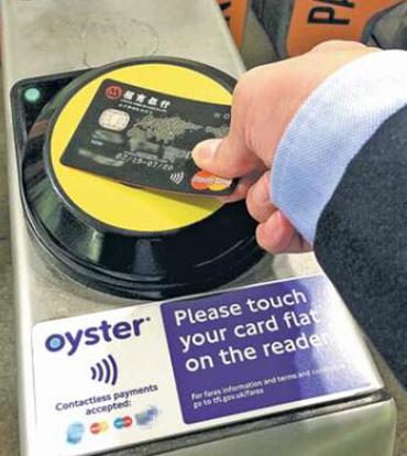 A passenger swaps a China Merchants Bank card supported by global payments company MasterCard to purchase a ride on a London subway. With rapid urbanization in China, MasterCard wants to help build smart cities in the country. (Photo provided to China Daily) A passenger swaps a China Merchants Bank card supported by global payments company MasterCard to purchase a ride on a London subway. With rapid urbanization in China, MasterCard wants to help build smart cities in the country. (Photo provided to China Daily)