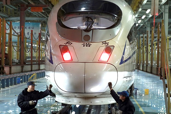 Technicians examine a nearly finished bullet train at a factory of CRRC Qingdao Sifang Co Ltd in Qingdao, Shandong province. CSR Sifang America JV, a CRRC subsidiary, clinched a $1.3-billion deal from the Chicago Transit Authority this month to supply up to 846 metro vehicles to the Midwestern city. (Photo provided to China Daily) Technicians examine a nearly finished bullet train at a factory of CRRC Qingdao Sifang Co Ltd in Qingdao, Shandong province. CSR Sifang America JV, a CRRC subsidiary, clinched a $1.3-billion deal from the Chicago Transit Authority this month to supply up to 846 metro vehicles to the Midwestern city. (Photo provided to China Daily)