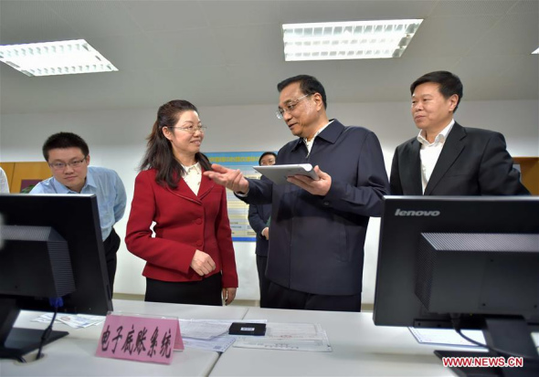 Chinese Premier Li Keqiang (2nd R) visits the State Administration of Taxation in Beijing, capital of China, April 1, 2016. Li Keqiang inspected the State Administration of Taxation and the Ministry of Finance on April 1, urging solid efforts from the financial and taxation authorities to deliver the value-added tax (VAT) reform as part of efforts to invigorate the real economy. (Photo: Xinhua/Li Tao) Chinese Premier Li Keqiang (2nd R) visits the State Administration of Taxation in Beijing, capital of China, April 1, 2016. Li Keqiang inspected the State Administration of Taxation and the Ministry of Finance on April 1, urging solid efforts from the financial and taxation authorities to deliver the value-added tax (VAT) reform as part of efforts to invigorate the real economy. (Photo: Xinhua/Li Tao)