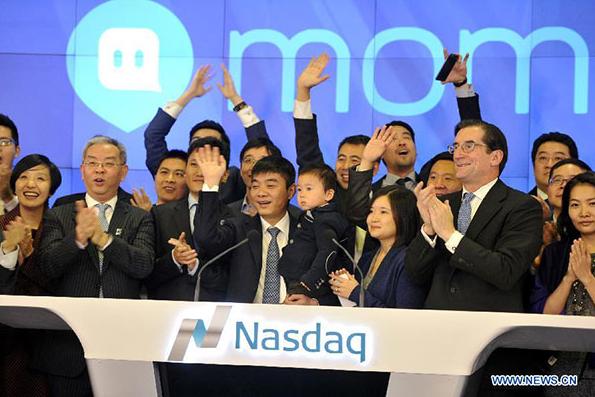 Tang Yan (center, front), founder and chief executive officer of China's mobile social networking platform Momo Inc attends the ceremony of ringing the opening bell at the NASDAQ in New York, the United States, Dec 11, 2014. (Photo/Xinhua) Tang Yan (center, front), founder and chief executive officer of China's mobile social networking platform Momo Inc attends the ceremony of ringing the opening bell at the NASDAQ in New York, the United States, Dec 11, 2014. (Photo/Xinhua)